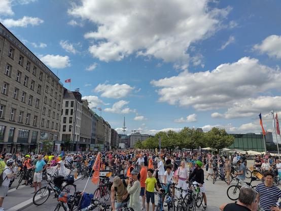 A large crowd of cyclists waiting at Hamburg's Binnenalster.