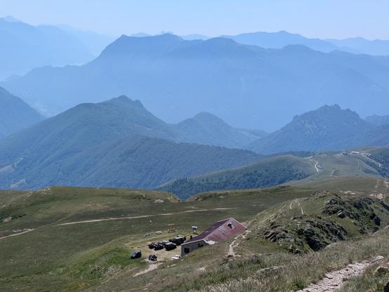 The mountains of Italy lake Como seen from Passo San Lucio on the border with Switzerland. A number of classic militare vehicles can ne seen parked below, including my 1968 Volvo L3315