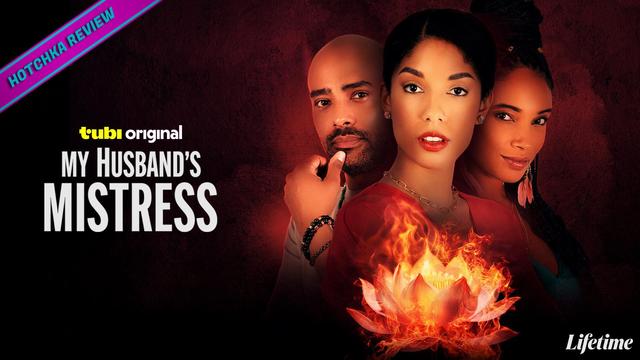 Hotchka Review: My Husband's Mistress. Three people — a bald man to the left, a woman with parted hair, red lipstick, a red top and gold necklace, and a woman with braids and dangling feather earrings —pose against a dark red textured backdrop with a flaming lotus flower in the foreground. The Lifetime network logo in white is at the bottom right. Tubi Original is in smaller font above the title logo on the left.