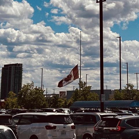 Canadian flag at half mast.