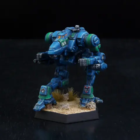 A painted miniature of a Viper 'Mech.  It is blue with green highlights, and the cockpit glass is orange.  The number "55" is on the left side of the head.  The emblem of Clan Diamond Shark is on the left leg.  The emblem of Beta Galaxy, a shark's head over a red circle, is on the right leg.