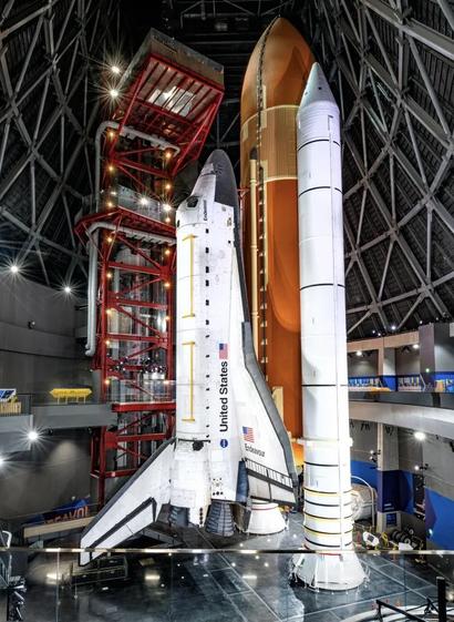 Space Shuttle Endeavour, displayed in its vertical launch position with external fuel tank and solid rocket boosters.