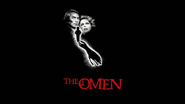 Black-and-white image of the faces of Gregory Peck and Lee Remick, the silhouette of a young boy lit from behind in white in front of and between them, casting the shadow of a jackal, "The Omen" logo in red below them with '666' contained in the 'O', all on a black background.