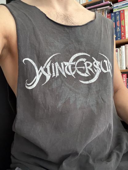 I‘m wearing a DYI tank top from worn out grey ish Wintersun band shirt with the tribal ish Wintersun logo on it.