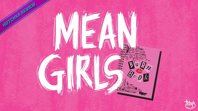 Hotchka Review: Mean Girls. Vivid pink backdrop with bold white MEAN GIRLS text; a pink spiral notebook shows a Burn Book with cut-out letters and a lipstick kiss.