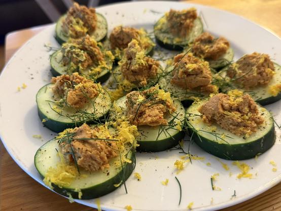 Spiced mackerel pate on cucumber 
Topped with lemon zest, fresh dill, and ground black pepper