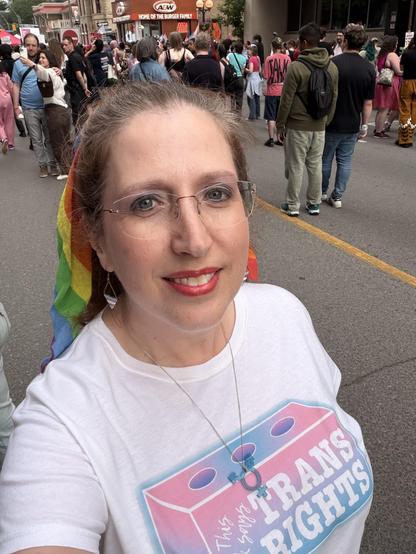 Selfie of me wearing a shirt that says “this brick says trans rights”