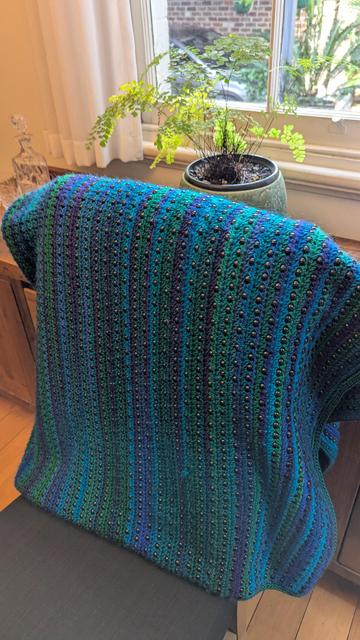 The same blanket across a chair.