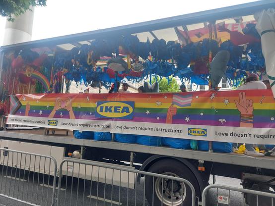 An IKEA pride float, with several Blåhaj.