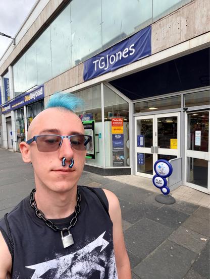selfie where I’m standing outside the TGJones shop on Argyle Street in Glasgow. they still don’t have a proper sign, just a banner that says “Temporary Sign” in the corner