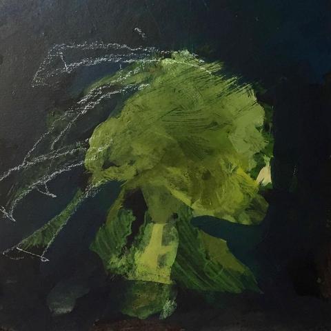 Progress photo of THE GREEN WOMAN showing early embellishment with white chalk over the initial green paint marks. The orientation has turned to stand up the mushroom-like shape. A yellow triangle on the right is the most obvious clue that a face is taking shape. The unusual stalk-like hair is starting to take shape in the chalk marks.