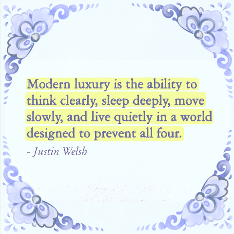A decorative frame with floral designs surrounds a quote highlighted in yellow. The quote reads, "Modern luxury is the ability to think clearly, sleep deeply, move slowly, and live quietly in a world designed to prevent all four," attributed to Justin Welsh.