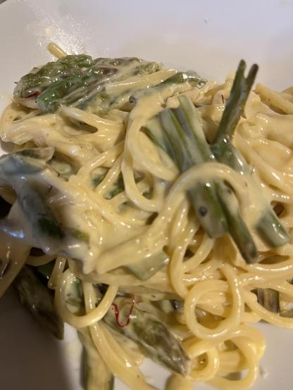Closeup of an asparagus carbonara dish