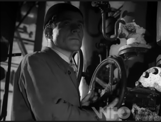 person holding with both hands a massive valve
