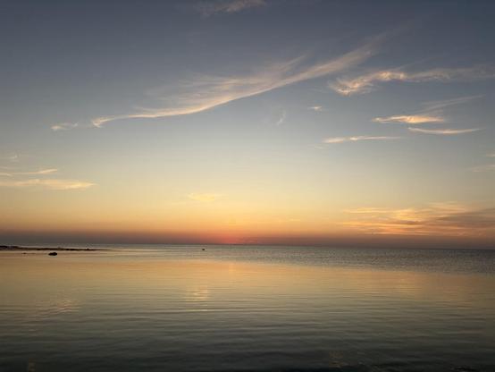 A calm sea just before dawn.