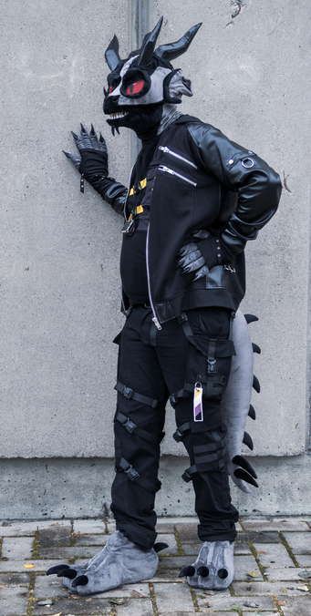 Aks wearing a lizard fur suit.