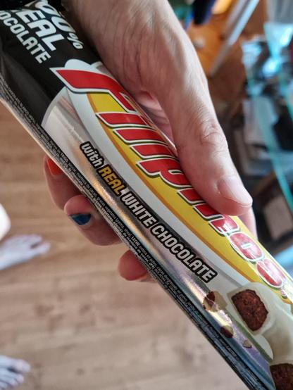 A snack that says "WITH REAL WHITE CHOCOLATE" on the package