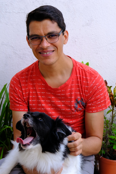 Federico Mena with a very fluffy dog.