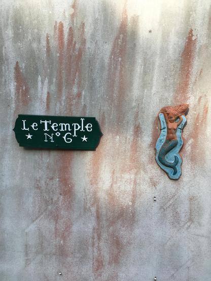 A mermaid on a wall in Brittany