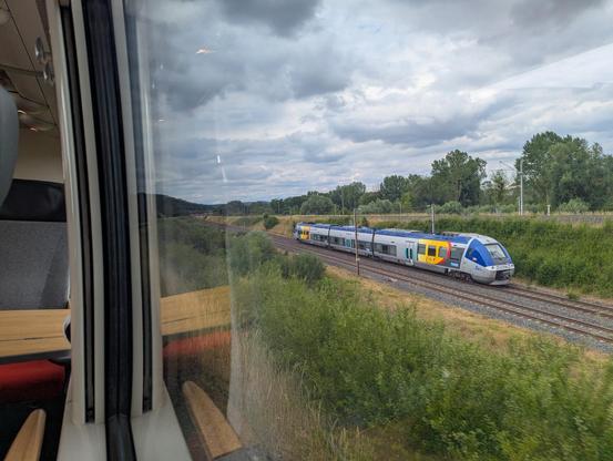An unrefurbished AGC in the old TER Lorraine colours seen from the train at the grade separated junction in Lérouville