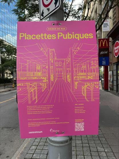 A photo of a large pink poster on a street advertising public spaces in French.  The title on the top of the poster is “Placette Pubique”, which loosely translates to “Pubic Square”