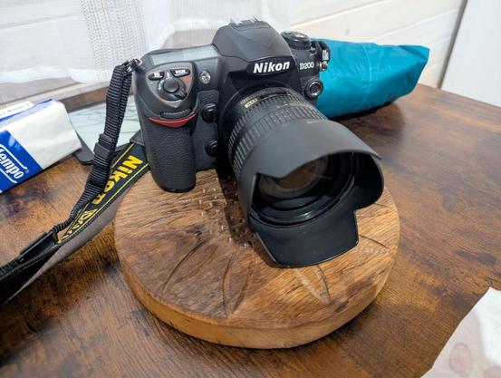 A Nikon D200 from 2006 in rather good condition and a 18-70 f/3.5-5.6 in rather run down condition. It was the first lens I ever bought.