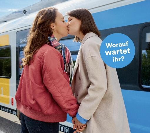 A picture of two women kissing each other
In the background is a DB Class 430