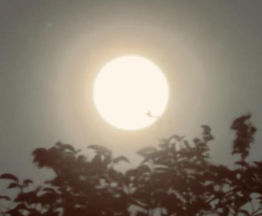 A full moon with hazy rings due to Saharan dust.