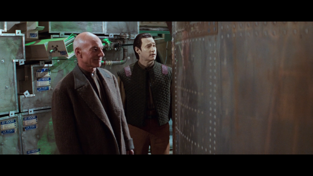 A shot from Star Trek: First Contact showing Picard and Data looking at the Phoenix.