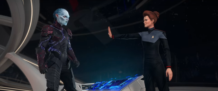 A shot from Star Trek: Prodigy showing Hologram Janeway holding up her hand in an authoritative way to the Diviner, who is standing across from her on the bridge of the Protostar. From E110