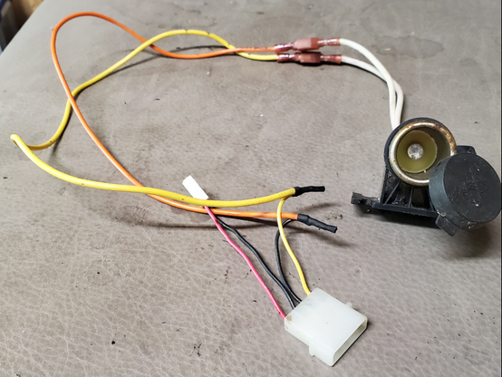 A computer Molex connector with 12v leads connected to a cigarette lighter receptical.