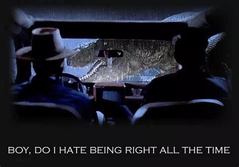 Escena de Parque Jurásico. Alan Grant e Ian Malcolm en el coche, viendo como un Tyrannosaurus se cruza por delante de ellos. Un texto dice la famosa frase de Malcolm: "Boy, do I hate being right all the time”.