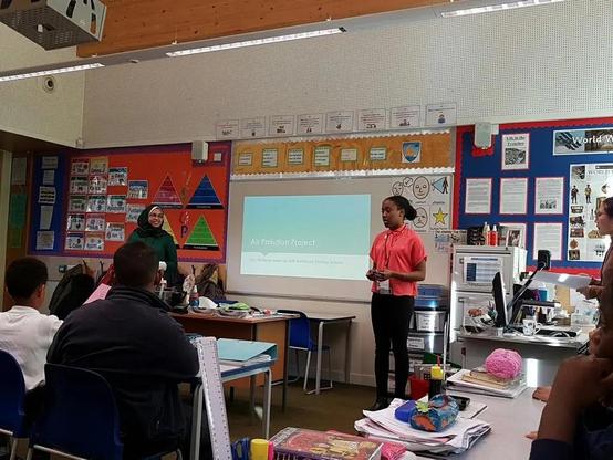 Two of our students presenting a lesson in a school in Hackney.