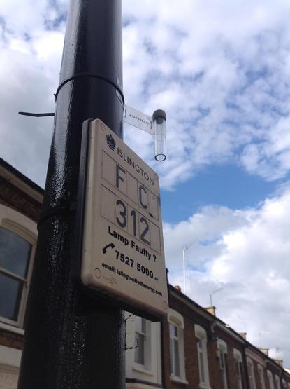 A home-made diffusion tube attached to a lamp post near Gillespie Primary School in Islington.