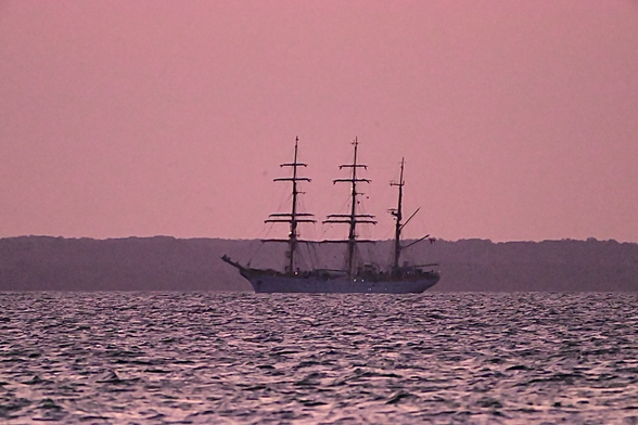Romanian tall ship with a pink sunset on the Chesapeake bay