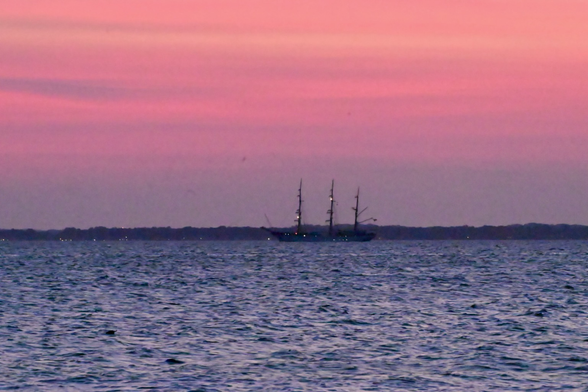 Romanian tall ship with a pink sunset on the Chesapeake bay