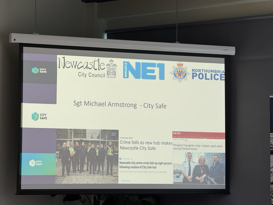 Projector showing a slide for City Safe, a police and local area safety initiative for Newcastle and the NE1 business district