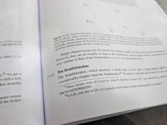 A picture of the lower right corner of an open book*, focused on a section heading: 11.4.2 The Snarkbreaker

* Conway's Game of Life, Mathematics and Construction by Nathaniel Johnston and Dave Greene, 2022.