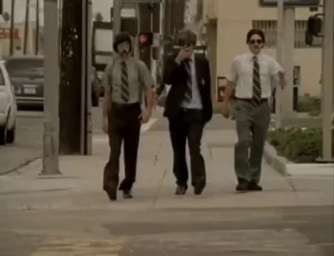 The Beastie Boys dressed up as 1970s cops with big mustaches and walking down the street in slow motion from the "Sabotage" fake cop show music video.