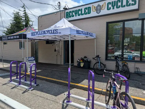 Six purpose staple racks have been newly installed in front of the bike shop named Recycled Cycles in the University District neighbourhood in Seattle, WA. The rightmost rack has my road bike locked to it.