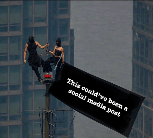Two people that climbed the Empire State Building with a black flag saying "This could’ve been a social media post". May their love endure monthly bills & adult responsibilities.