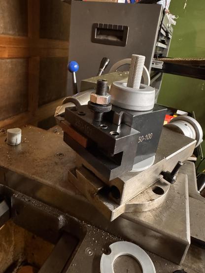 The same setup as from the previous photo but this time a quick change tool post has been installed on the stud and spacer ring showing that a tool can be well aligned to a dead center placed in the tail stock.