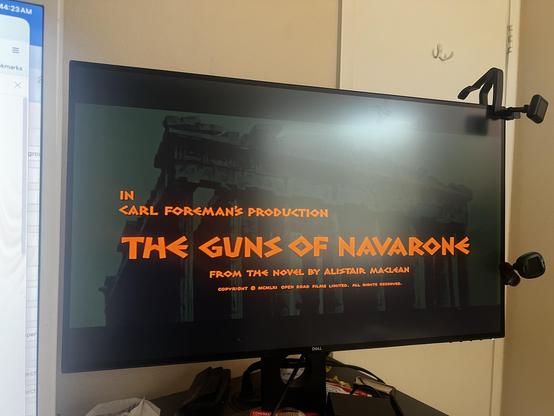 Photo of computer monitor playing The Guns of Navarone on it.