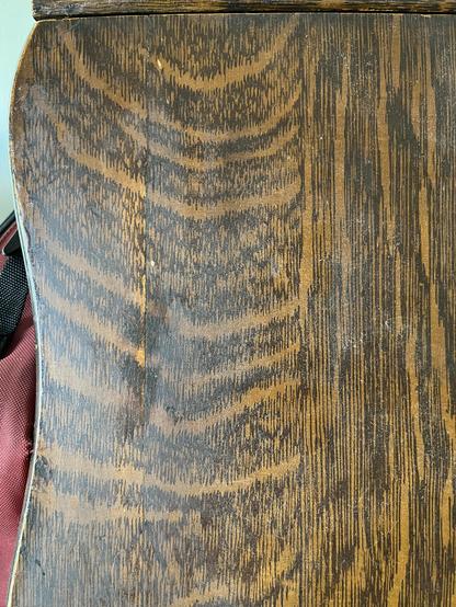Faux oak paint job from the 1930s. From a distance you'd never even notice.