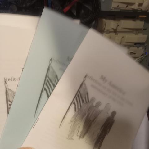 Pamphlet with flag and figures on it titled My America.