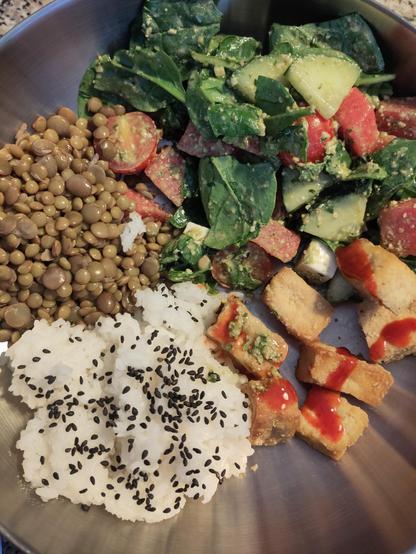 Tofu with rice, lentils, spinach salad with vegan feta and tomatoes with pesto