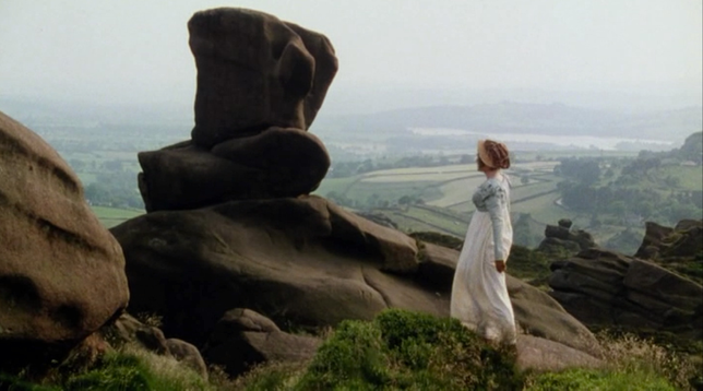 Picture of Jennifer Ehle as Elizabeth Bennet in Pride and Prejudice, standing on a rocky promontory looking out over the Derbyshire Peaks.