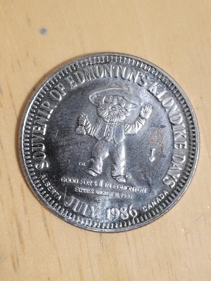 Coin that reads "Souvenir of Edmonton's Klondike Days, June 1986".