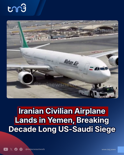 An image displays a large white airplane on an airport tarmac with bold overlaid text. The aircraft features the words "Mahan Air" in black on its fuselage and has a green tail. A pushback vehicle is located at the nose of the plane. Large, highlighted text reads, "Iranian Civilian Airplane Lands in Yemen, Breaking Decade Long US-Saudi Siege". At the top left is a white logo reading "tmj", and the bottom contains social media icons alongside "[@]tmjnewsnetwork" and the website "www.tmj.news".