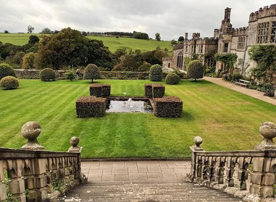 Haddon Hall sude view from the steps down from the upper garden and terrace to the lower lawn and fountain.